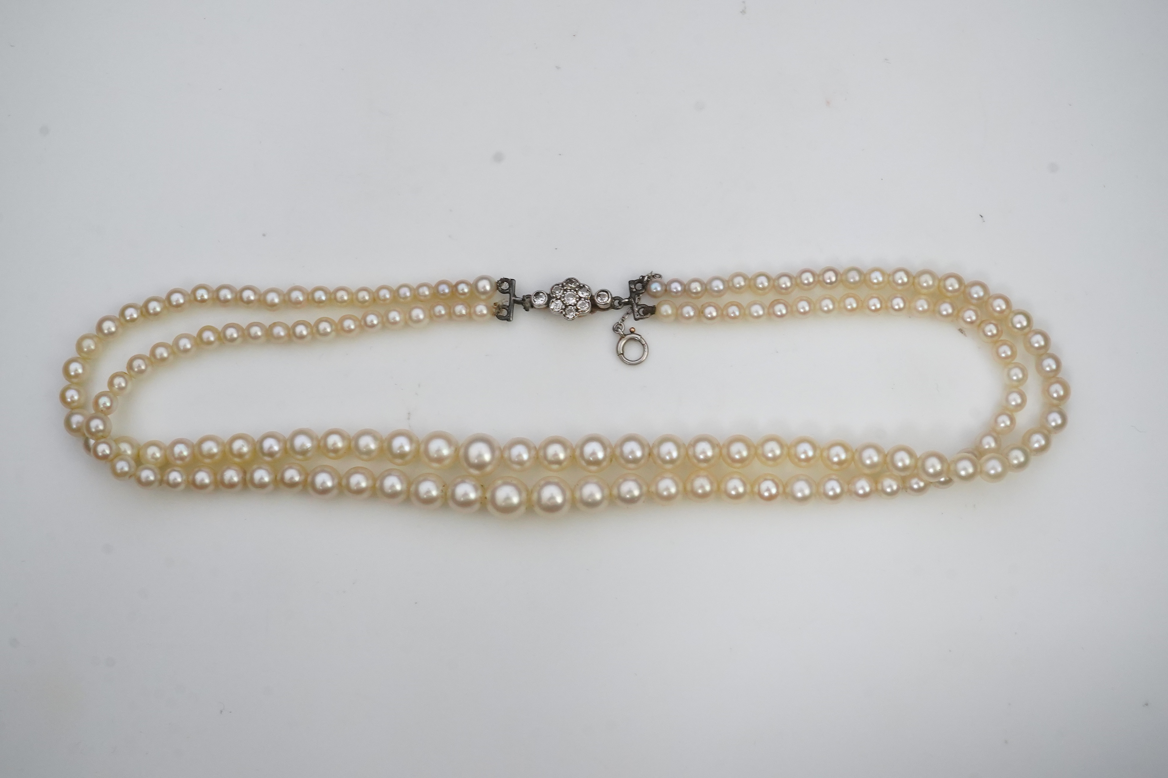 A cultured pearl and diamond necklace, early 20th century and later